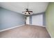 Bedroom with neutral carpet, closet and ceiling fan at 18035 Cadence St, Orlando, FL 32820