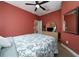 Bedroom featuring neutral carpet, ceiling fan and closet at 18035 Cadence St, Orlando, FL 32820