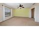 Bedroom with neutral carpet, closet and ceiling fan at 18035 Cadence St, Orlando, FL 32820