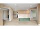 Bright hallway with neutral carpet and paint, offering access to multiple rooms and featuring a charming storage bench at 18035 Cadence St, Orlando, FL 32820