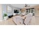 Spacious living room features a plush sectional sofa, large TV, and neutral color palette, offering a relaxing atmosphere at 18035 Cadence St, Orlando, FL 32820