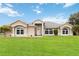 Charming single-story home with well-manicured lawn and beautiful architectural details at 1960 Jan Lan Blvd, St Cloud, FL 34772