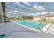 Sparkling screened-in pool with a spacious deck, perfect for relaxation and outdoor enjoyment at 1960 Jan Lan Blvd, St Cloud, FL 34772