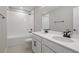 Elegant bathroom features a double sink vanity with modern fixtures and a shower-tub combo at 1488 August Gray Dr, Kissimmee, FL 34744
