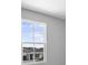 A view through the window shows the neighboring home and bright blue skies at 1488 August Gray Dr, Kissimmee, FL 34744