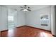 Bedroom with wood-look floors and ensuite bathroom at 450 Tamarind Parke Ln, Kissimmee, FL 34758