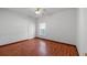 Bedroom with hardwood floors and a window at 450 Tamarind Parke Ln, Kissimmee, FL 34758