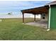 Covered patio with pavers, wooden pergola, and ceiling fan at 450 Tamarind Parke Ln, Kissimmee, FL 34758