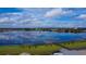 Picturesque lake view showcasing waterfront living and lush green surroundings at 6078 Bimini Twist Loop, Orlando, FL 32819