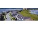 Aerial view of a residential area featuring attractive houses and a calm, serene lake nearby at 6078 Bimini Twist Loop, Orlando, FL 32819