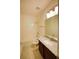 Bright bathroom featuring single sink vanity with granite countertop and shower-tub combo at 6078 Bimini Twist Loop, Orlando, FL 32819