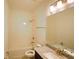 Bright bathroom featuring single sink vanity with granite countertop and shower-tub combo at 6078 Bimini Twist Loop, Orlando, FL 32819