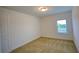 Bedroom with carpeted floor and window at 6078 Bimini Twist Loop, Orlando, FL 32819