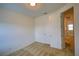 Bedroom with neutral carpet and an open door at 6078 Bimini Twist Loop, Orlando, FL 32819