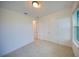 Bedroom with tile floor, a window and a double door closet at 6078 Bimini Twist Loop, Orlando, FL 32819