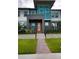 Charming townhome with meticulously maintained front yard, modern design, and inviting entrance at 6078 Bimini Twist Loop, Orlando, FL 32819