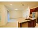 Open concept kitchen featuring granite countertops, stainless steel appliances, and a breakfast bar for modern living at 6078 Bimini Twist Loop, Orlando, FL 32819