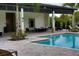 Community poolside lounge area with comfortable seating and lush landscaping at 6078 Bimini Twist Loop, Orlando, FL 32819