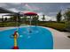 Community splash pad featuring interactive water elements and shade covers, creating a fun play area at 6078 Bimini Twist Loop, Orlando, FL 32819