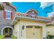 Close up view of a home's architecture, detailing the unique stone accents and attached garage at 14038 Millington St, Orlando, FL 32832