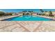 Community pool featuring clear blue water, lounge chairs, and cabanas for relaxation and recreation under the sun at 14038 Millington St, Orlando, FL 32832