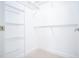 A walk-in closet contains white wire shelving to maximize storage at 14038 Millington St, Orlando, FL 32832