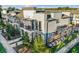 Contemporary townhome exterior featuring private balconies, modern design, and well-maintained landscaping at 1800 Houston St, Kissimmee, FL 34743