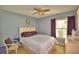 Bedroom with double bed, ceiling fan, and dresser at 458 Hunter Cir, Kissimmee, FL 34758