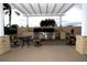 Outdoor kitchen and dining area with pergola at 504 Ridge View Dr, Davenport, FL 33837