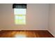 Bedroom featuring hardwood floors and a window letting in natural light at 504 Ridge View Dr, Davenport, FL 33837