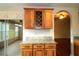 Dining area featuring wooden cabinets and wine rack with granite countertop overlooking sunroom and additional living area at 504 Ridge View Dr, Davenport, FL 33837