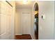 Hallway featuring a closet and an arched doorway leading to the main living area at 504 Ridge View Dr, Davenport, FL 33837