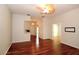 Bright living room with hardwood floors, fan, and open floor plan to other rooms in the home at 504 Ridge View Dr, Davenport, FL 33837