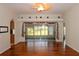 Bright living room featuring hardwood floors, fan and sliding glass doors to the screened lanai at 504 Ridge View Dr, Davenport, FL 33837