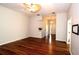 Bright living room with hardwood floors, fan, and open floor plan leading to the front door at 504 Ridge View Dr, Davenport, FL 33837