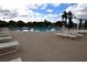 Community pool area with plenty of lounge chairs at 504 Ridge View Dr, Davenport, FL 33837
