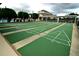 Community shuffleboard courts, promising leisurely recreation amidst green surroundings and community buildings at 504 Ridge View Dr, Davenport, FL 33837