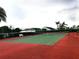 Community tennis court with red and green surface at 504 Ridge View Dr, Davenport, FL 33837