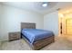 Bedroom featuring a bed with wood headboard and carpet flooring at 527 Noble Ave, Davenport, FL 33837