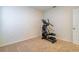 Bright bedroom featuring neutral walls, carpeted flooring and an elliptical exercise machine at 527 Noble Ave, Davenport, FL 33837