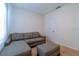 Living room features a sectional sofa, ottoman, carpeted flooring, and lots of natural light at 527 Noble Ave, Davenport, FL 33837