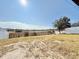 Backyard with a white vinyl fence and a view of a lake at 723 Benjamin Trl, Davenport, FL 33837