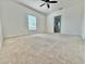 Spacious bedroom with carpet flooring and large window at 723 Benjamin Trl, Davenport, FL 33837