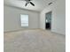 Bright bedroom featuring carpet and ceiling fan at 723 Benjamin Trl, Davenport, FL 33837