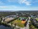 Community overview showing homes, recreational areas, and a lake at 9650 Bay Pine Ln, Orlando, FL 32832