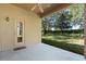 Covered back patio with access to the backyard at 9650 Bay Pine Ln, Orlando, FL 32832