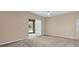 Primary bedroom with sliding door access to the backyard at 9650 Bay Pine Ln, Orlando, FL 32832