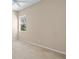 Large bedroom with carpet, window, and neutral wall tones at 9650 Bay Pine Ln, Orlando, FL 32832