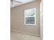 Well-lit bedroom featuring carpet floors, a window with blinds, and closet at 9650 Bay Pine Ln, Orlando, FL 32832