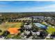 Aerial view of community center, tennis courts, and playground at 9650 Bay Pine Ln, Orlando, FL 32832